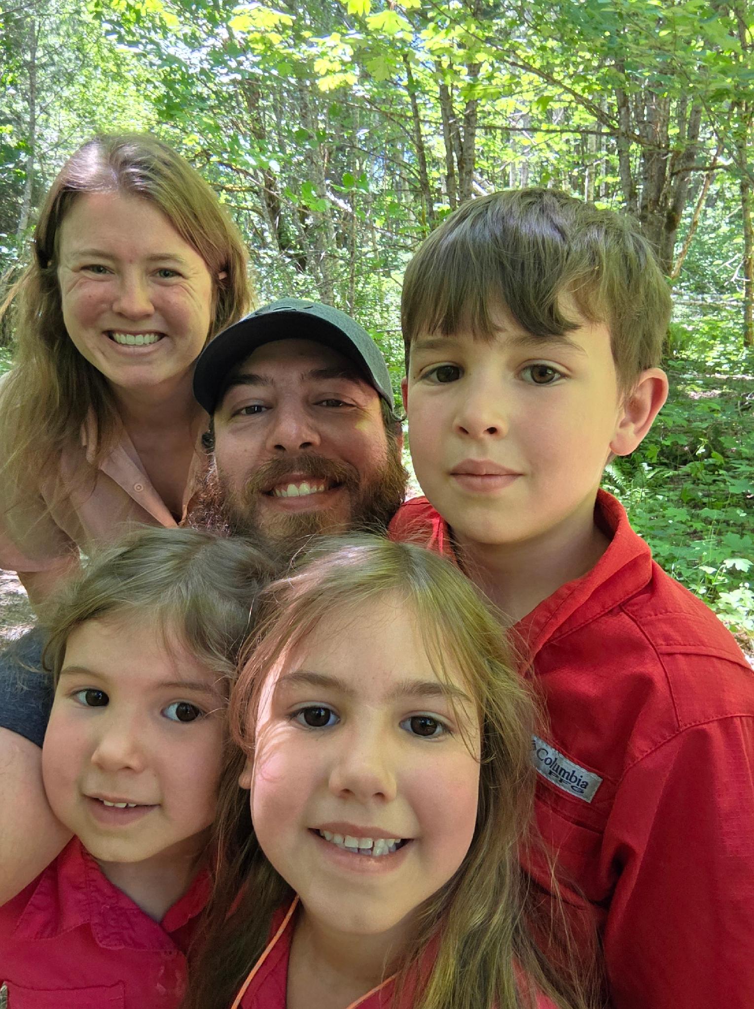 Family selfie together in the woods