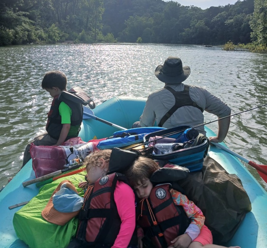 Family paddling on the river